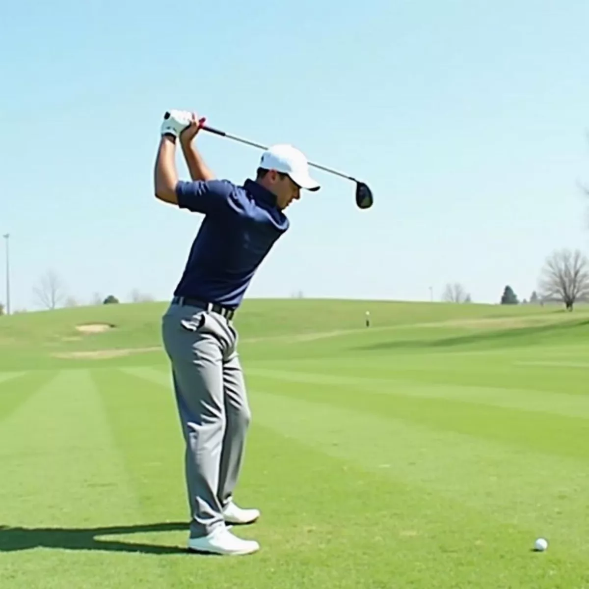 Golfer Finishing Swing With 3-Wood