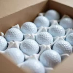 Golf balls stored in box