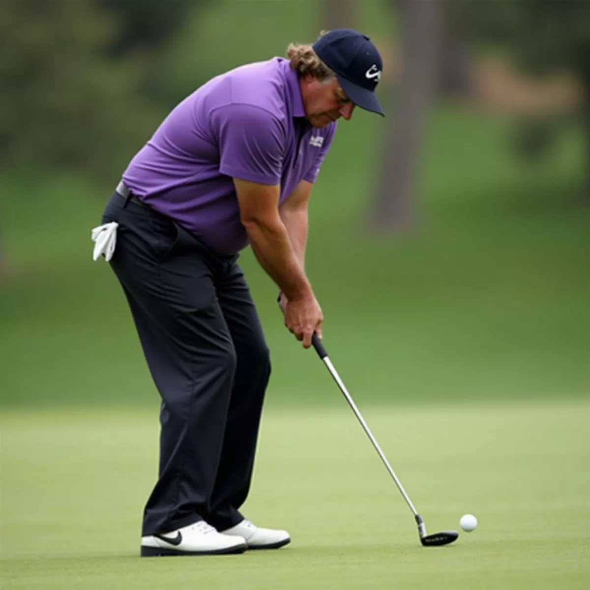 Phil Mickelson Hitting A Wedge Shot From Near The Green