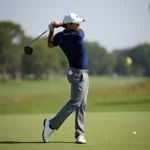 Rory Mcilroy Swinging A Golf Club