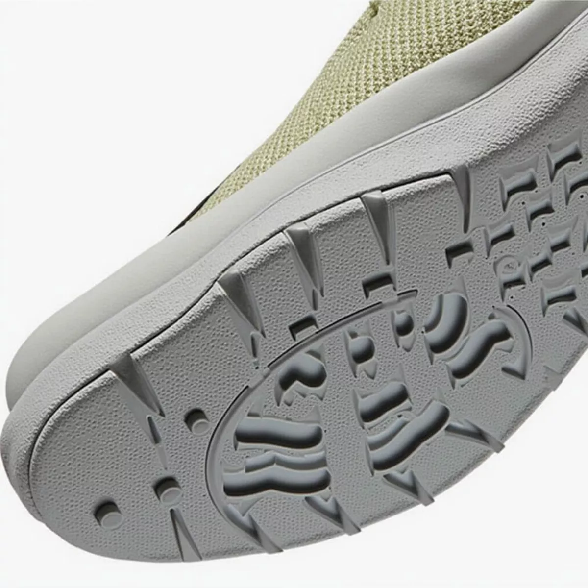 Close-Up Of The Tomo Alpha Golf Shoes' Spikeless Traction Pattern