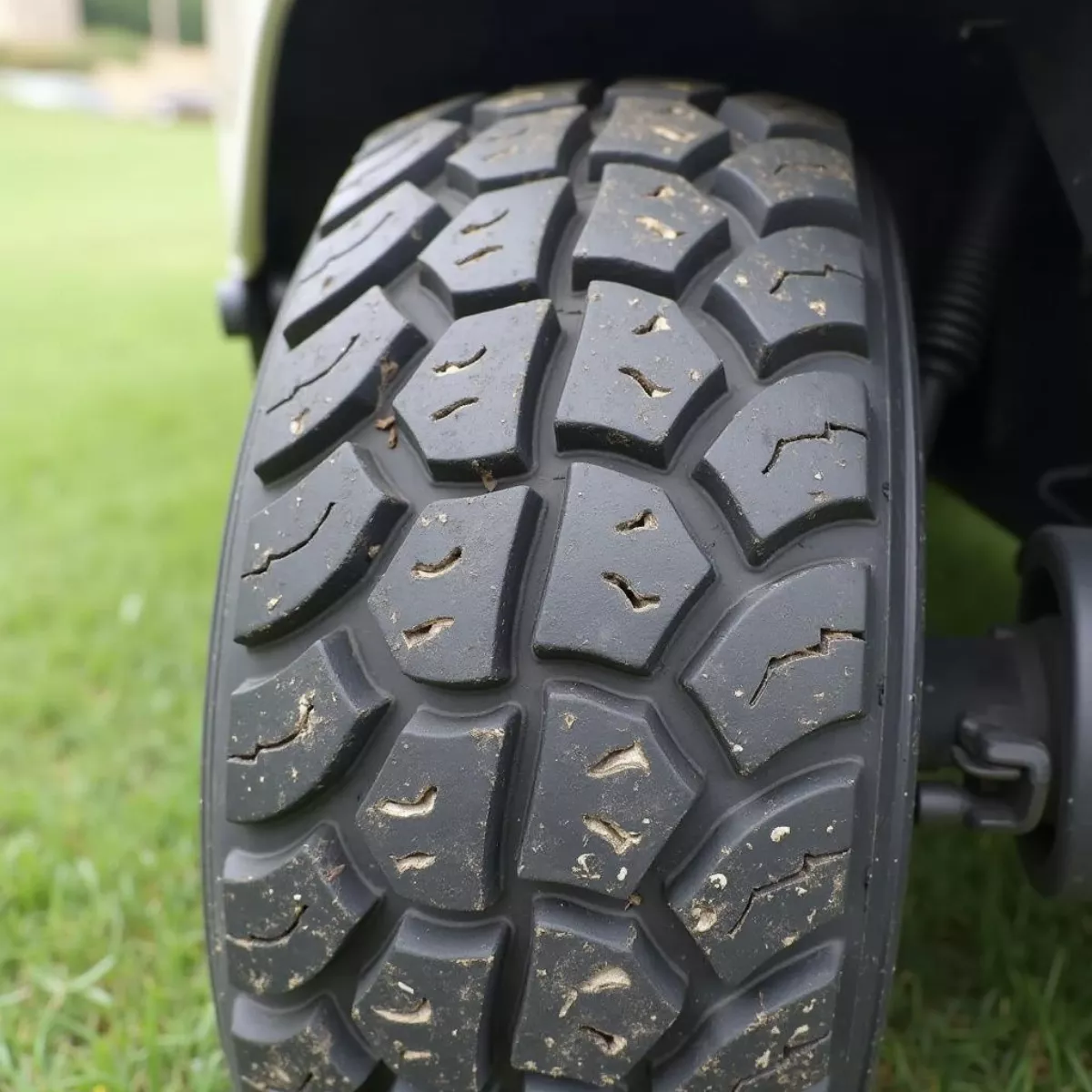 Worn Out Golf Cart Tire With Visible Damage